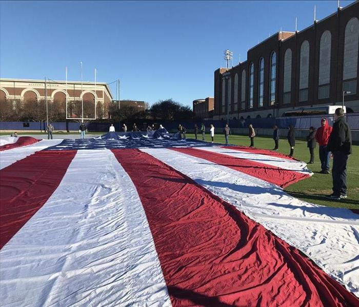 American flag on football field