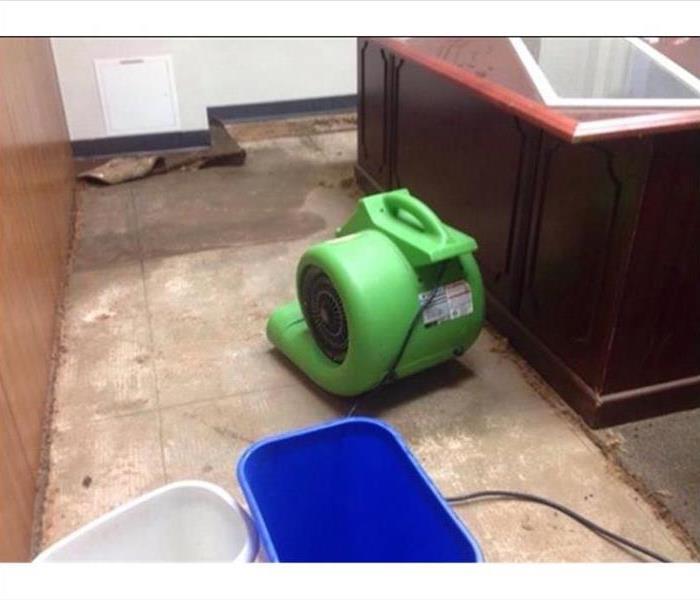 drying equipment on water damaged floor