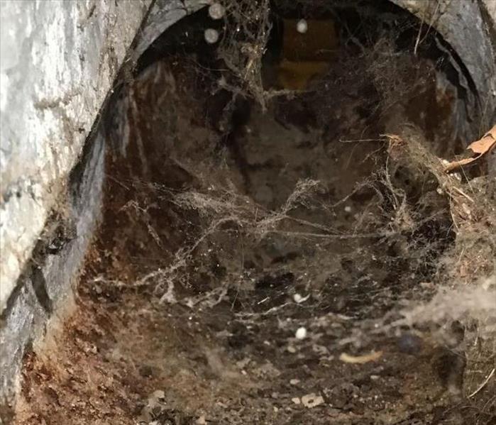duct filled with dirt and debris